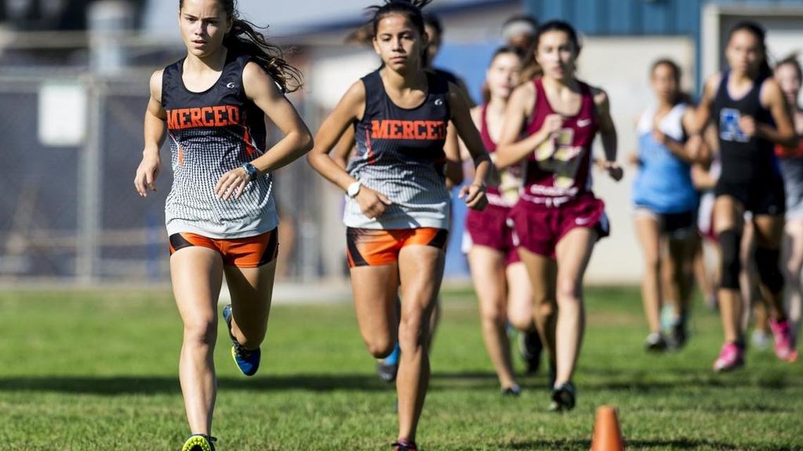 Merced's Quinn Hagerman, left, leads the pack during the Merced County Championships cross country meet at Atwater High School in Atwater, Calif, Saturday, Oct. 15, 2016.