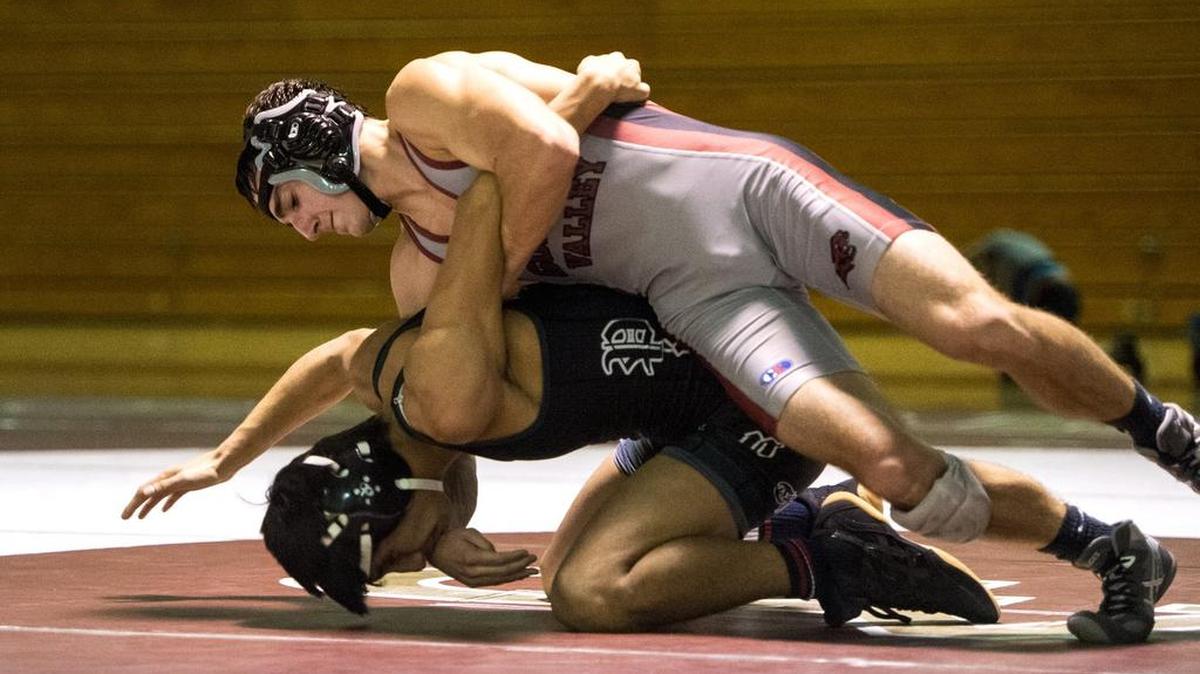 Golden Valley's Daniel Carlin controls Pitman's Mark Sanchez during a wrestling match at Golden Valley High School in Merced, Calif., Wednesday, Jan. 6, 2016.