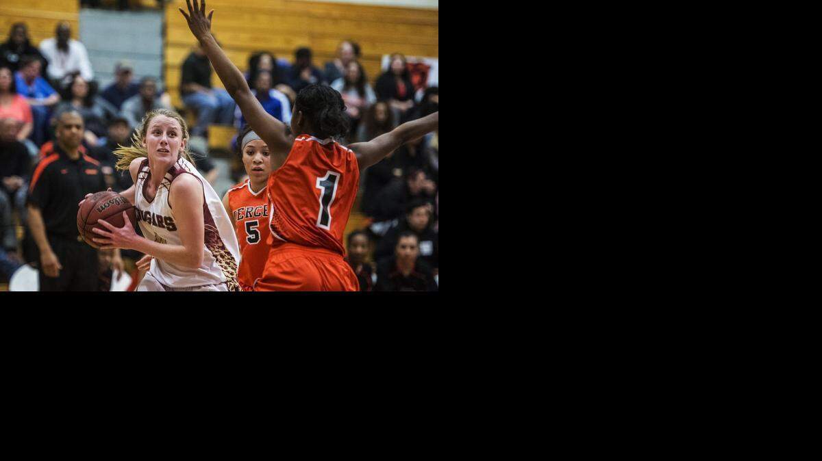 
Golden Valley’s Stephanie Moore, left, looks to score two of her 11 points against Merced. Moore and the Cougars hope to host a first-round playoff game.
