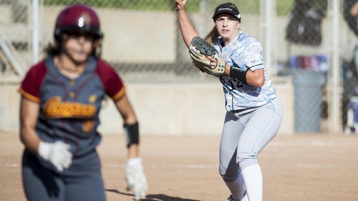 El Capitan senior pitcher Cassie Gasper (12) turns to throw to first base for an out during a game against Golden Valley at Joe Herb Park in Merced, Calif., on Thursday, March 16, 2017. The Gauchos beat the Cougars 5-4 in extra innings.
