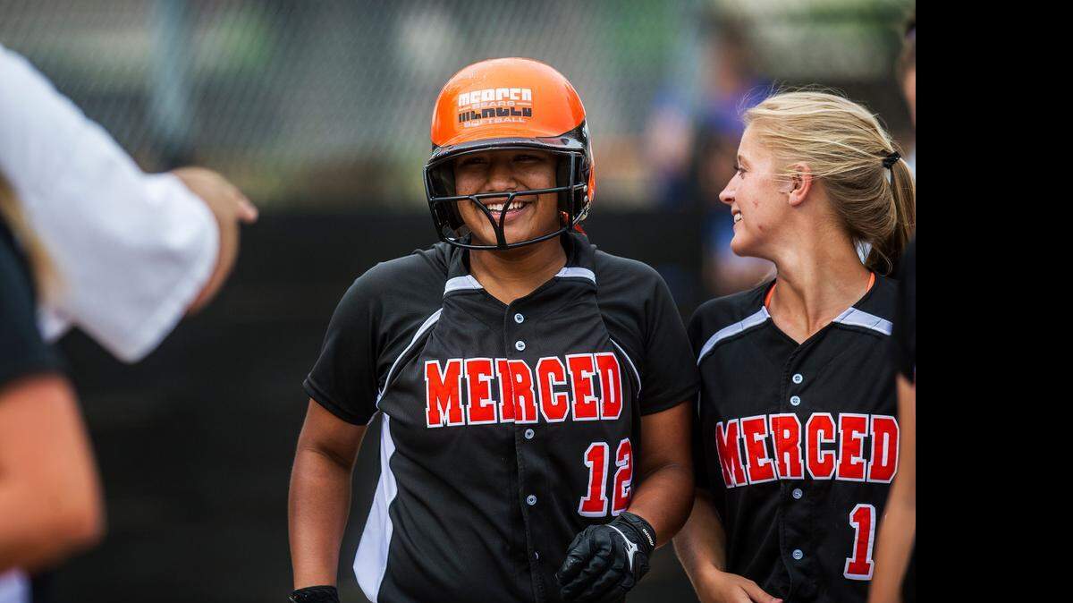 Merced’s Mo Collins, above left, smiles after her home run gave the Bears a 2-0 cushion for ace, Madilyn Nickles, bottom right. Nickles struck out 12 with no walks. The Bears can clinch their fifth consecutive conference title Friday.<252>
