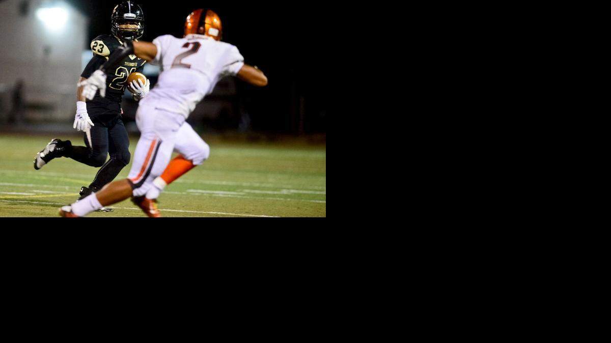
Buhach Colony senior running back Aundre Sherman (23) cuts toward the sideline during a game against Merced at Atwater High School in Atwaterin October. Sherman will play his college ball at Humboldt State University.

