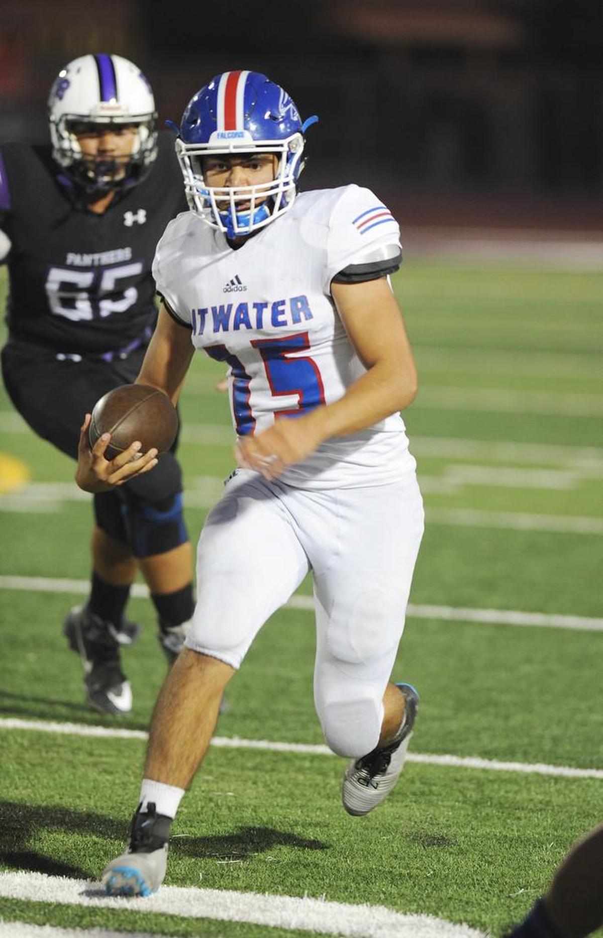 Atwater High School quarterback, Isaiah Deleon scrambles for yardage Fri., Sept. 7, 2018 against Pacheco High School in Los Banos.