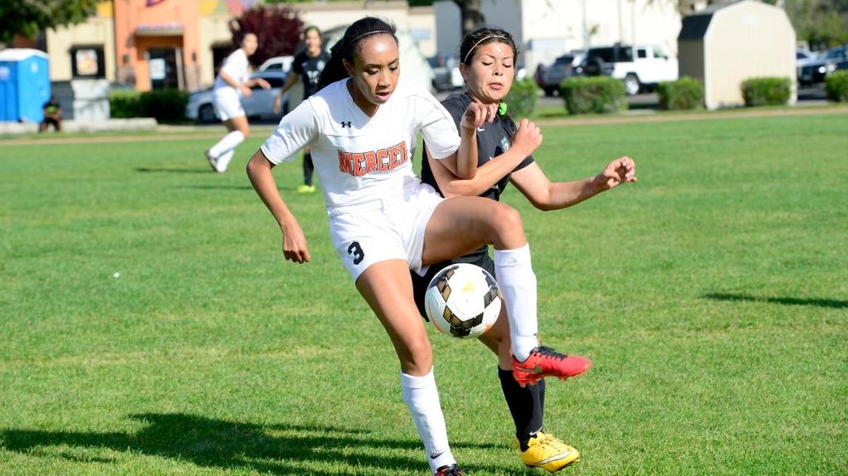 Merced striker Anisa Saechao (3) tried to bring down a ball while Pitman's Liz Perez applied pressure from behind. Saechao scored a goal in the 3-3 tie. Thursday, March 24, 2016 in Merced.
