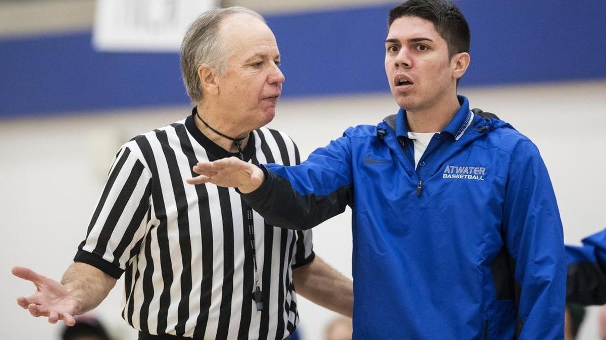 Atwater head coach Kanoa Smith argues a call with the referee during a game against Golden Valley at Atwater High School in Atwater, Calif., on Friday, Jan. 12, 2018. The Cougars beat the Falcons 75-69.