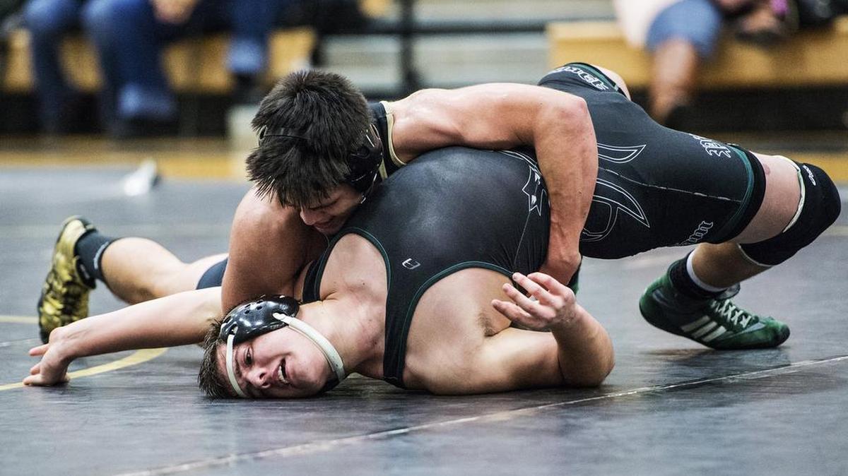 Buhach Colony's Juan Rosales pins Pitman's Brendan Tallent during a wrestling match at Buhach Colony High School in Atwater, Calif., Wednesday, Jan. 27, 2016.