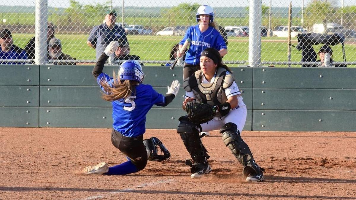 Atwater's Eileen Martinez (5) slides safely across the plate as El Capitan catcher Toni Perez waits for a throw home. It was the only run in the game as the Falcons defeated the Gauchos 1-0 in eight innings. Thursday, March 23, 2017 in Merced.