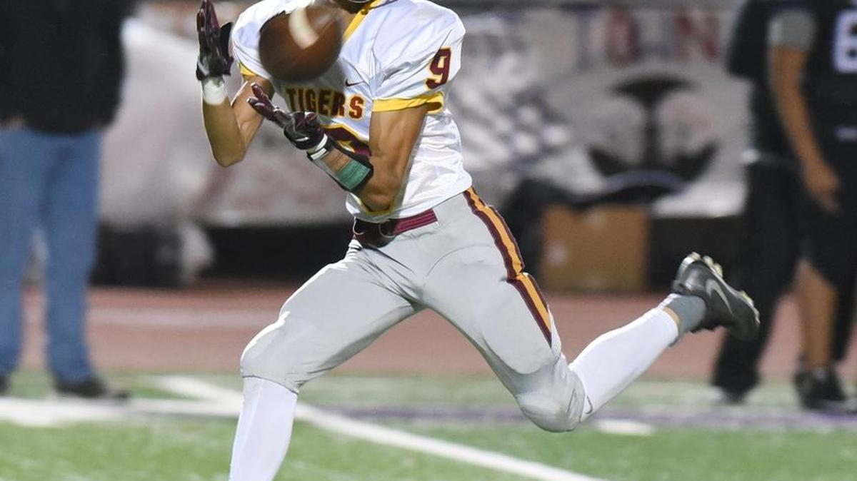 Los Banos High School wide receiver, Daniel Guerrero catches a ball and scores a touchdown with 5:40 remaining in the second quarter Fri., Nov. 3, 2017 against Pacheco High School at Veterans Stadium in Los Banos.