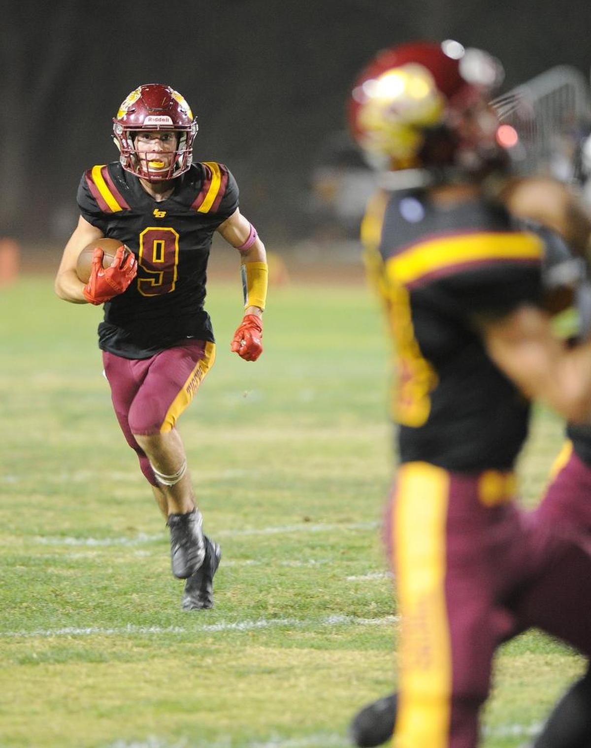 Los Banos High running back, Justin Incaprera follows a block by Anthony VanderPoel late in the second quarter Fri., Oct. 26, 2018 against Pacheco High at Loftin Stadium in Los Banos.