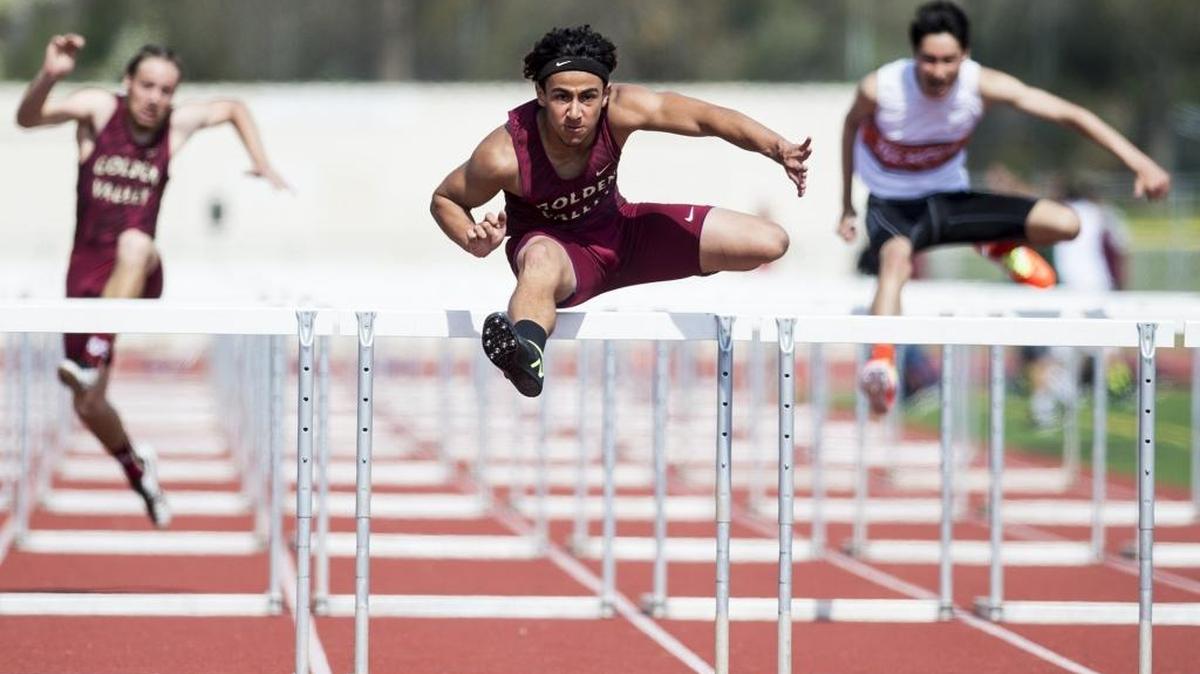 Golden Valley senior Shawn Bettencourt clears the final hurdle during the boys 110 meter hurdles at the Merced County Track and Field Championships at Golden Valley High School in Merced, Calif., on Saturday, March 11, 2017.