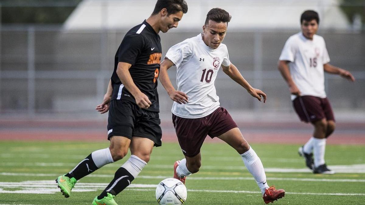 
Golden Valley senior Alfred Arroyo (10) challenges Merced senior Adrian Lomeli (8) for control of the ball during a game at Veterans Stadium at Golden Valley High School in Merced, Calif., Tuesday, Oct. 13, 2015. The game ended in a 1-1 tie.
