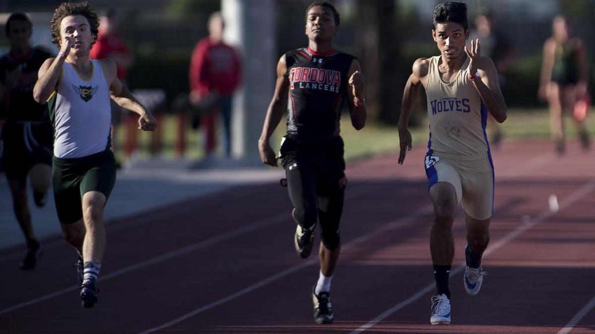Livingston runner Abhishek Singh, right, pulls ahead of Cordova's Andrew Roberts, center and Isaac Bowers, left, during the Sac-Joaquin Section Track and Field Division IV-V Finals at the California State University, Stanislaus in Turlock, Calif., on Thursday, May 18, 2017. Singh won the race with a time of 51.84.