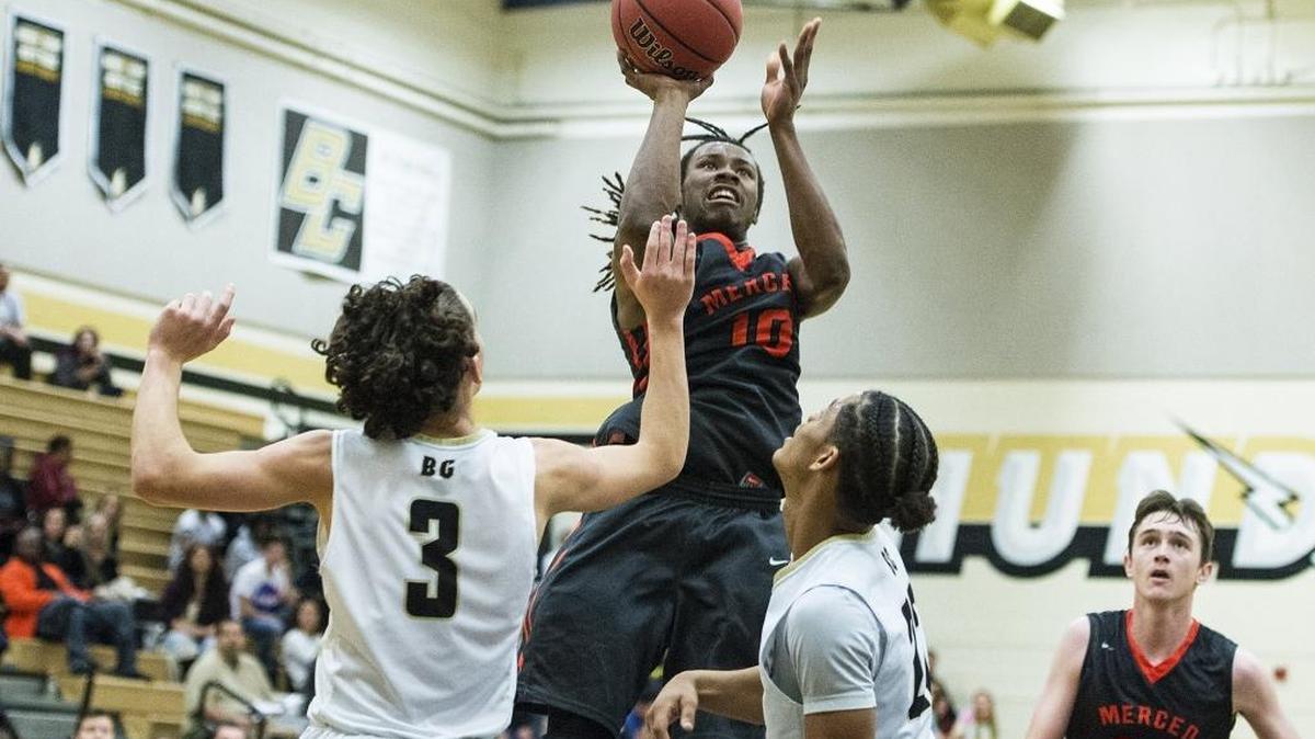 Merced junior Dhameer Warren (10) attempts a jump shot during a game against Buhach Colony at Buhach Colony High School in Atwater, Calif., on Friday, Jan. 5, 2018. The Bears beat the Thunder 47-42.