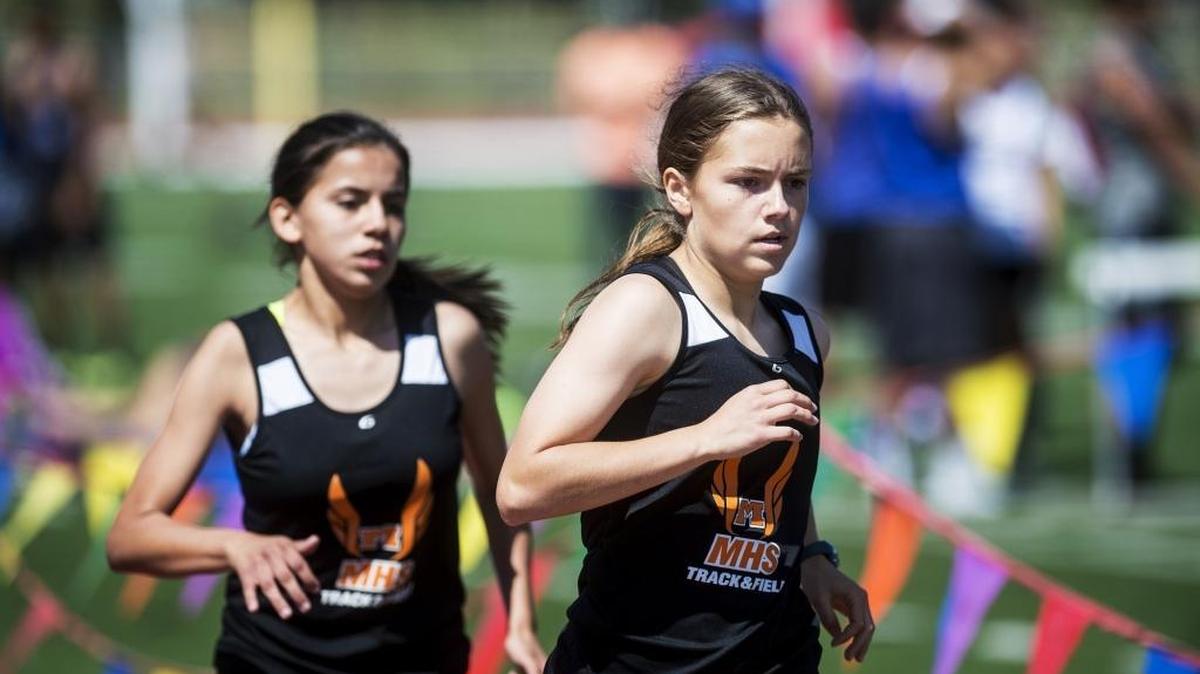 Merced freshman Quinn Hagerman, right, and Merced sophomore Ciara Colon, left, lead the pack during the girls 800 meter race during the CCC Center Track Meet at Golden Valley High School in Merced, Calif., Wednesday, April 13, 2016.