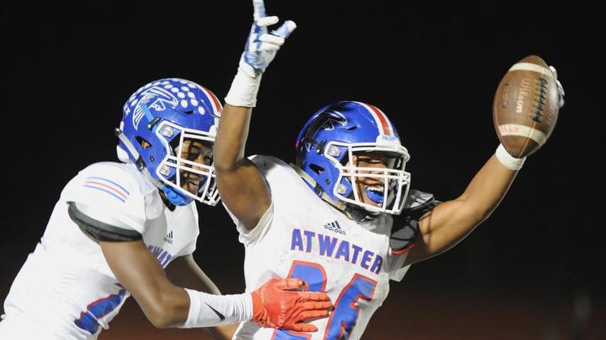 Atwater running back Charles Jackson, right, celebrates after scoring a touchdown in the third quarter Friday, Sept. 7, 2018 in Los Banos against Pacheco High School.
