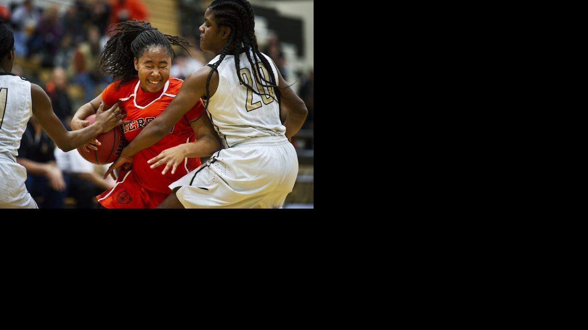 
Merced‘s Lexi Thompson (4) attempts to get past Buhach Colony’s Brandy Coward (20) during Thursday night’s CCC opener in Atwater.
