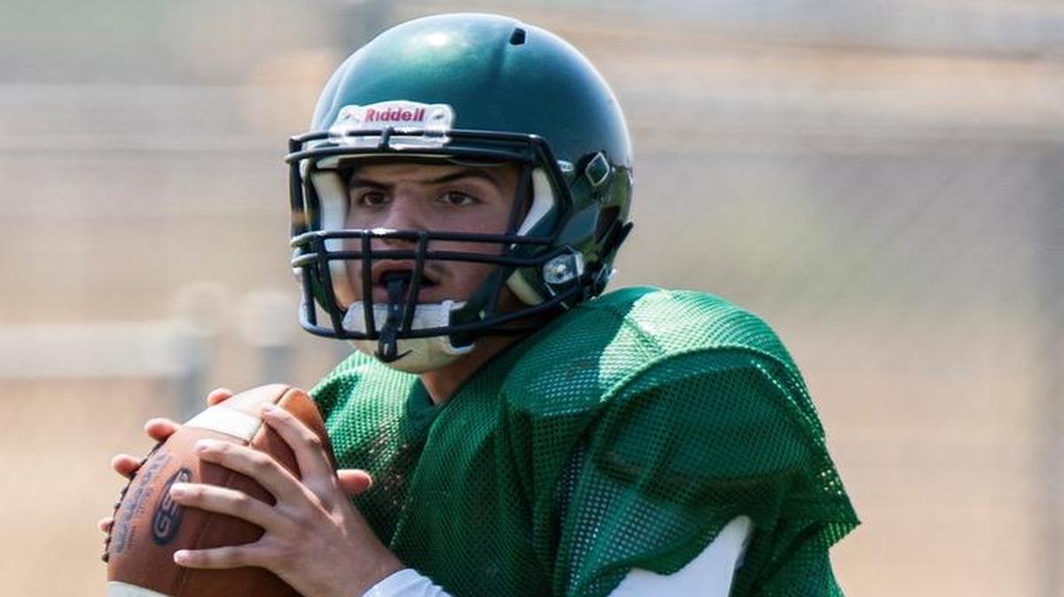 Le Grand quarterback Beto Marquez drops back to pass during a scrimmage at Le Grand High School in Le Grand, Calif., Saturday, Aug. 20, 2016. Marquez was one of five Bulldog players to exit last week’s game with an injury against Yosemite last week. Le Grand played the final 15 minutes with just 10 healthy players.