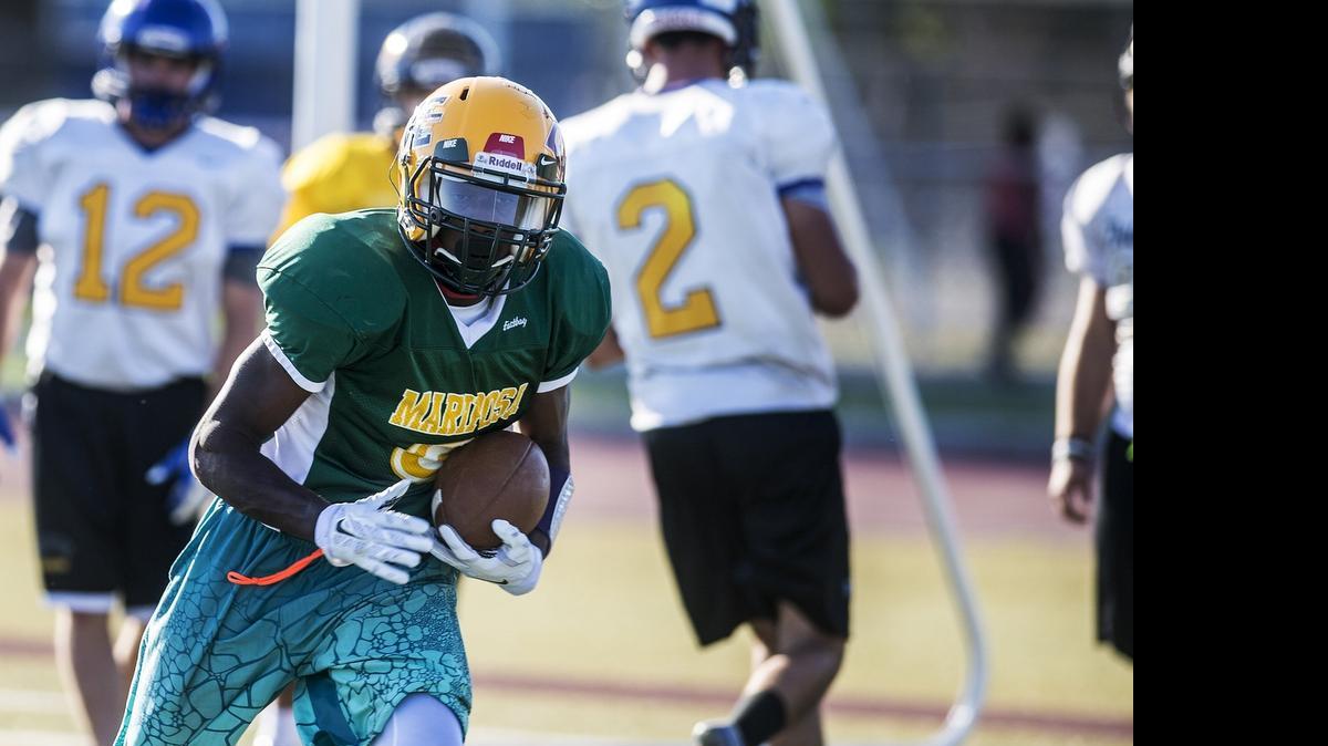 
Mariposa’s Kama’Re Bailey rushes  during practice for the annual North/South Rotary All-Star Football Game on Wednesday at Atwater High School.
