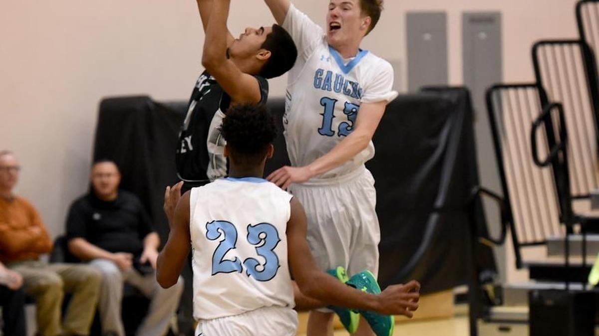 El Capitan's James Sellers (13) blocks the shot attempt of Central Valley's Josh Sidhu. Sellers and company rolled to a 28-point victory. Monday, Jan. 25, 2016 at the Stable Center.
