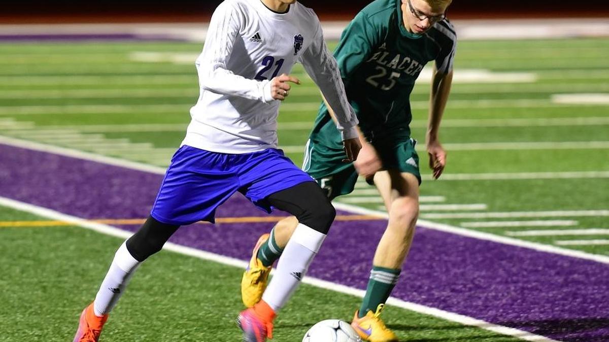 Pacheco striker Cesar Martinez (21) pushes the ball down the wing on the counterattack. Martinez had three goals and one assist in the Panthers' 7-0 victory over Placer. Thursday, Feb. 23, 2017 in Los Banos.