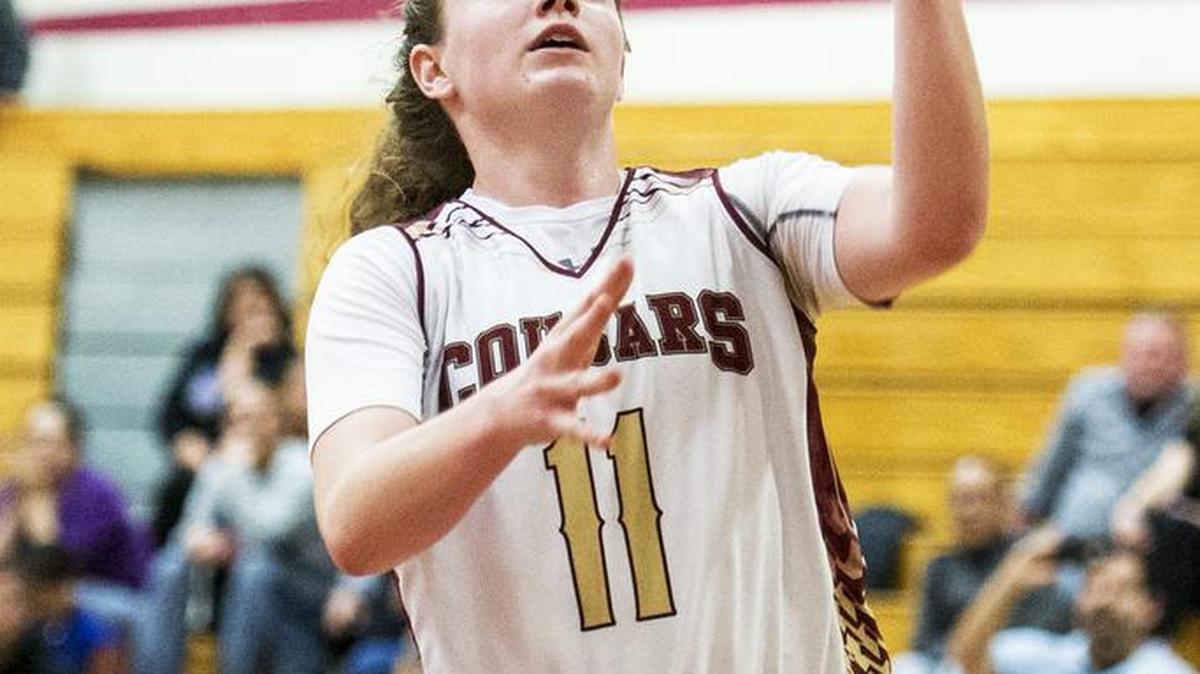 Golden Valley sophomore Delia Moore (11) scores a layup during a game against Franklin in the first round of the CIF Sac-Joaquin Section Division 1 Playoffs at Golden Valley High School in Merced, Calif., Tuesday, Feb. 23, 2016. The Cougars beat the Wildcats 68-52.
