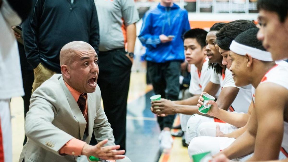 Merced head coach Hector Nava speaks to his players during a game against Atwater at Merced High School in Merced, Calif., on Wednesday, Jan. 18, 2017. The Bears beat the Falcons 52-49.
