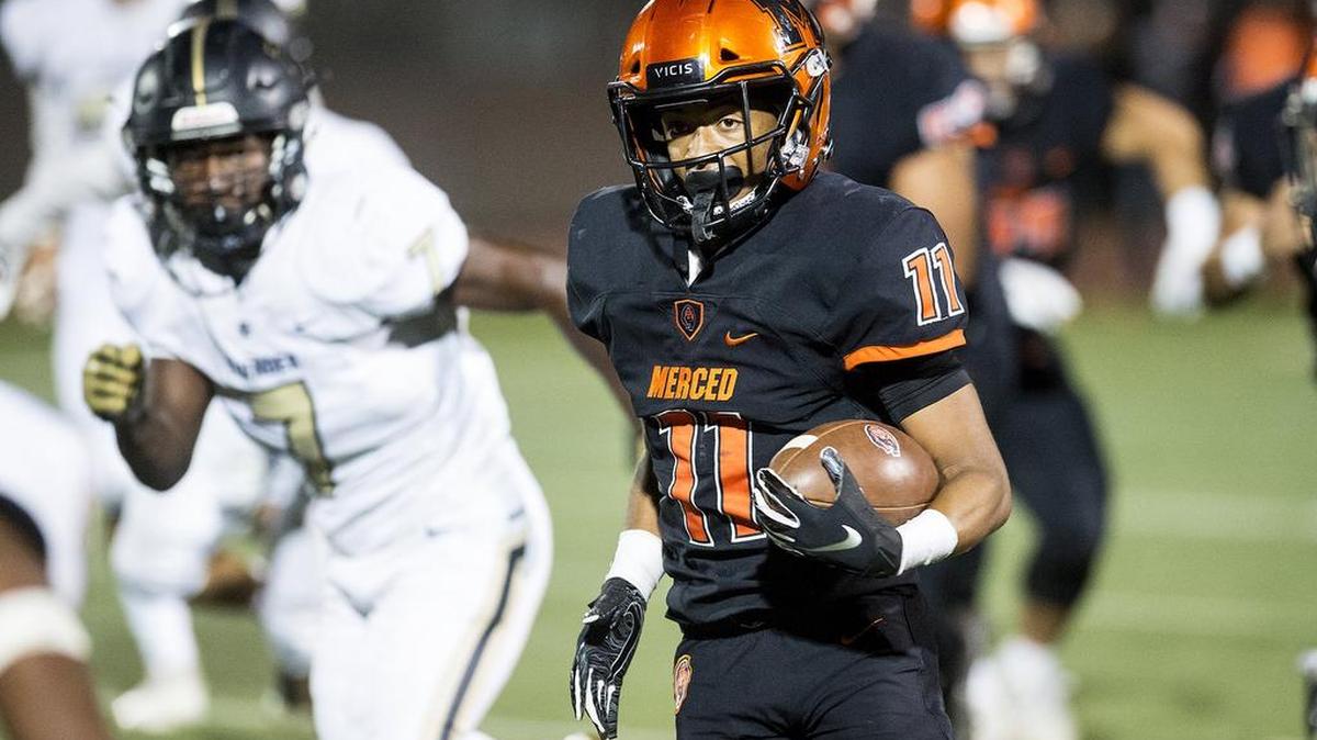 Merced junior Desmond Thompson (11) rushes for a large gain during a game against Buhach Colony at Veterans Stadium in Merced, Calif., on Friday, Oct. 5, 2018. The Bears beat the Thunder 55-14.