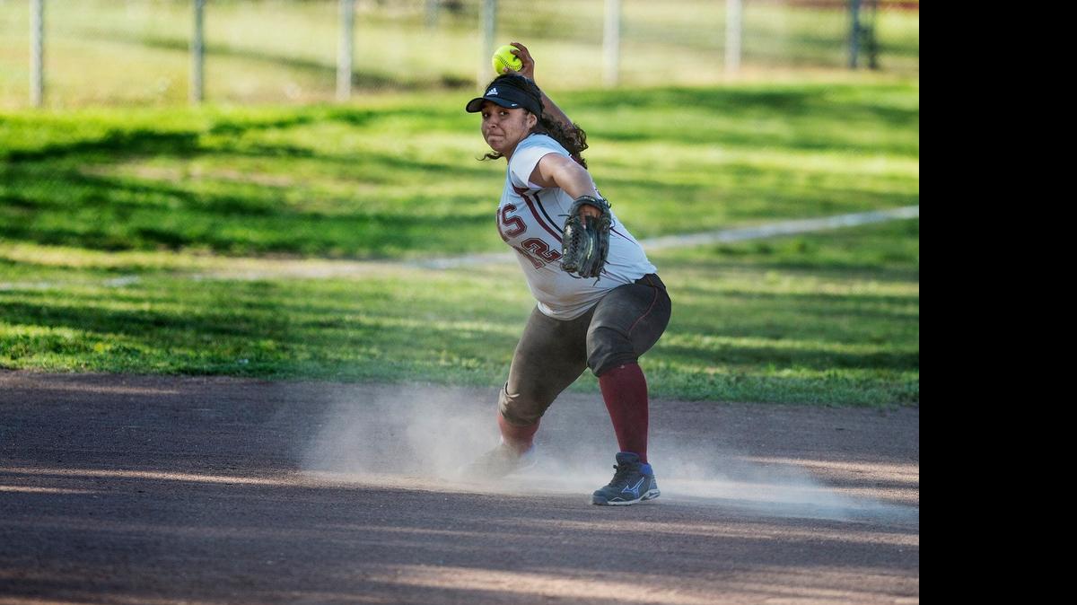 
Golden Valley senior Shyan Crutcher throws to first base for an out during a game against Merced at Joe Herb Park in Merced, Calif., in March. 

