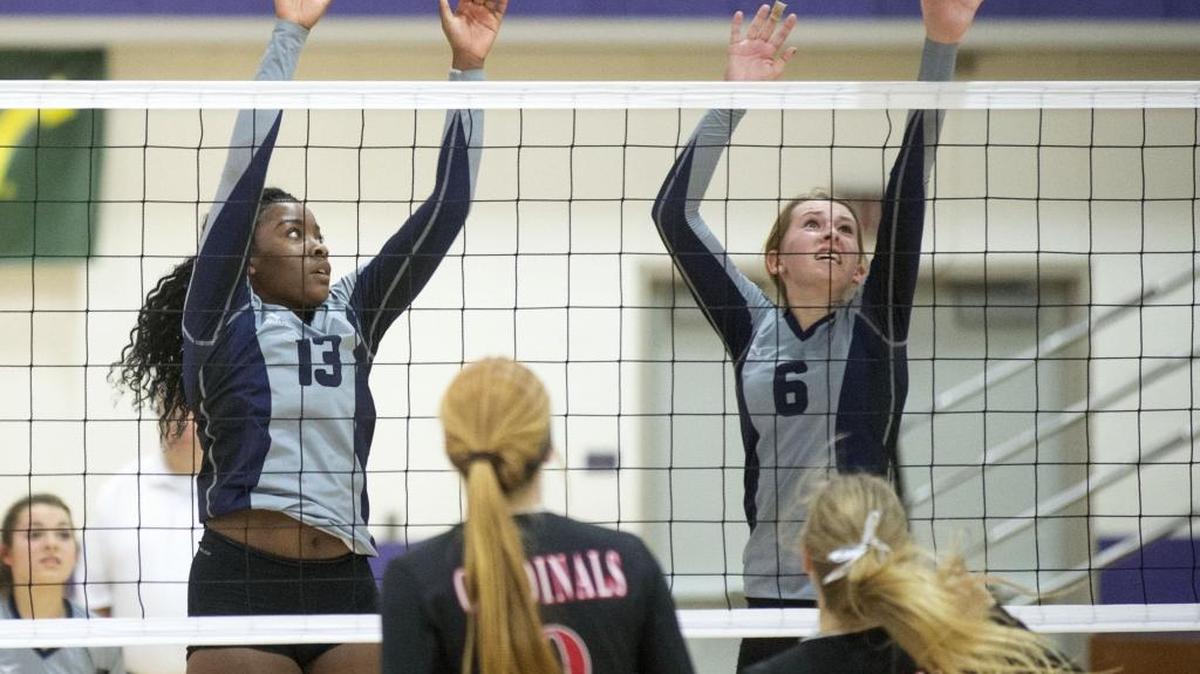 Stone Riddge Christian’s Aubriana Vander Woude (6) blocks a ball during the Sac-Joaquin Section Division VI Volleyball Championship between Stone Ridge Christian and Woodland Christian at Tokay High School in Lodi on Saturday.