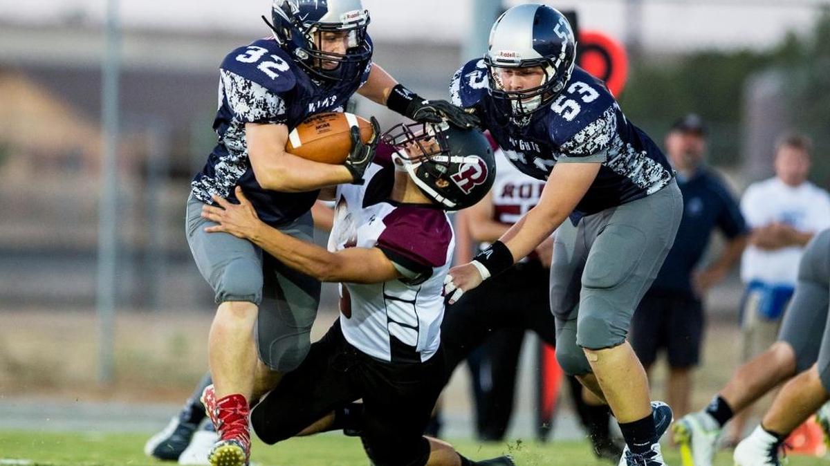 Owen Thomas (32) stiff-arms a defender while rushing during a game against Sierra Ridge/Rite of Passage last season for Stone Ridge Christian. Thomas is eligible to make his debut for Buhach Colony on Friday night against El Capitan after transferring this year.