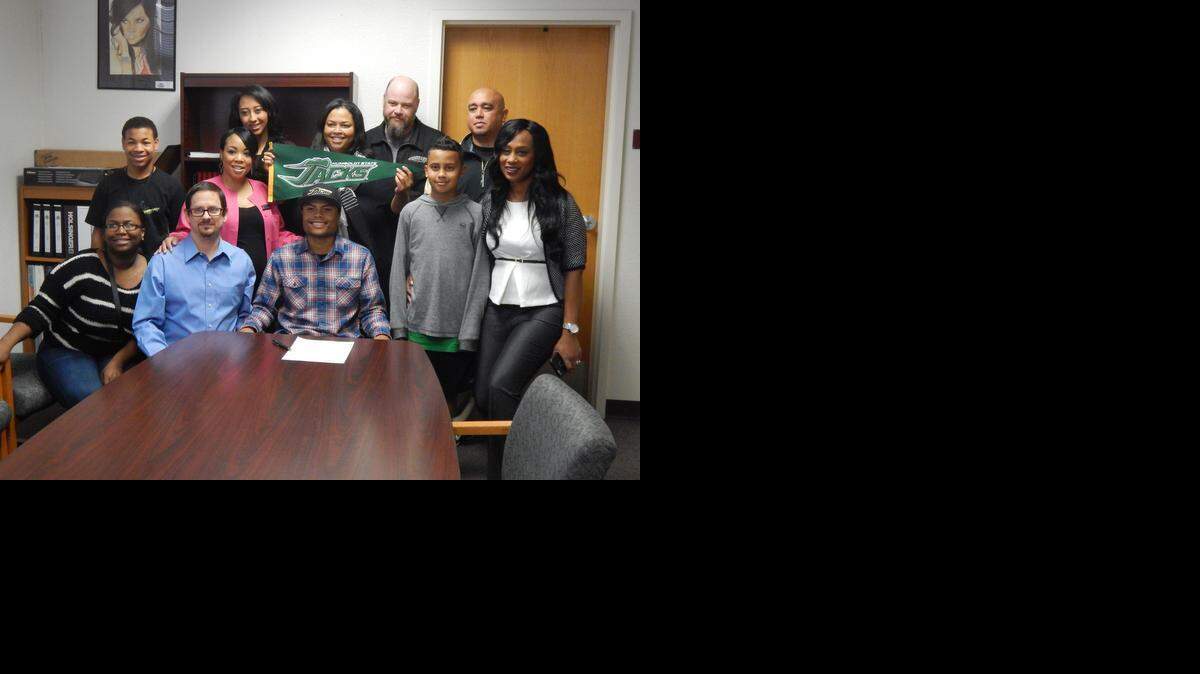 
Buhach Colony High senior Aundre Sherman is surrounded by family and friends after signing his national letter of intent to Humboldt State University on Wednesday morning at Buhach Colony High. Back row from left to right: Back row from left to right: Ahmand Presley, Nycole Grey, Syndey Alexander, Teresa Sherman, Justin Day, Kevin Navarra. Front row: Ashlee Carter, Mike Appel, Aundre Sherman, Seth Alexander, Joy Appel.
