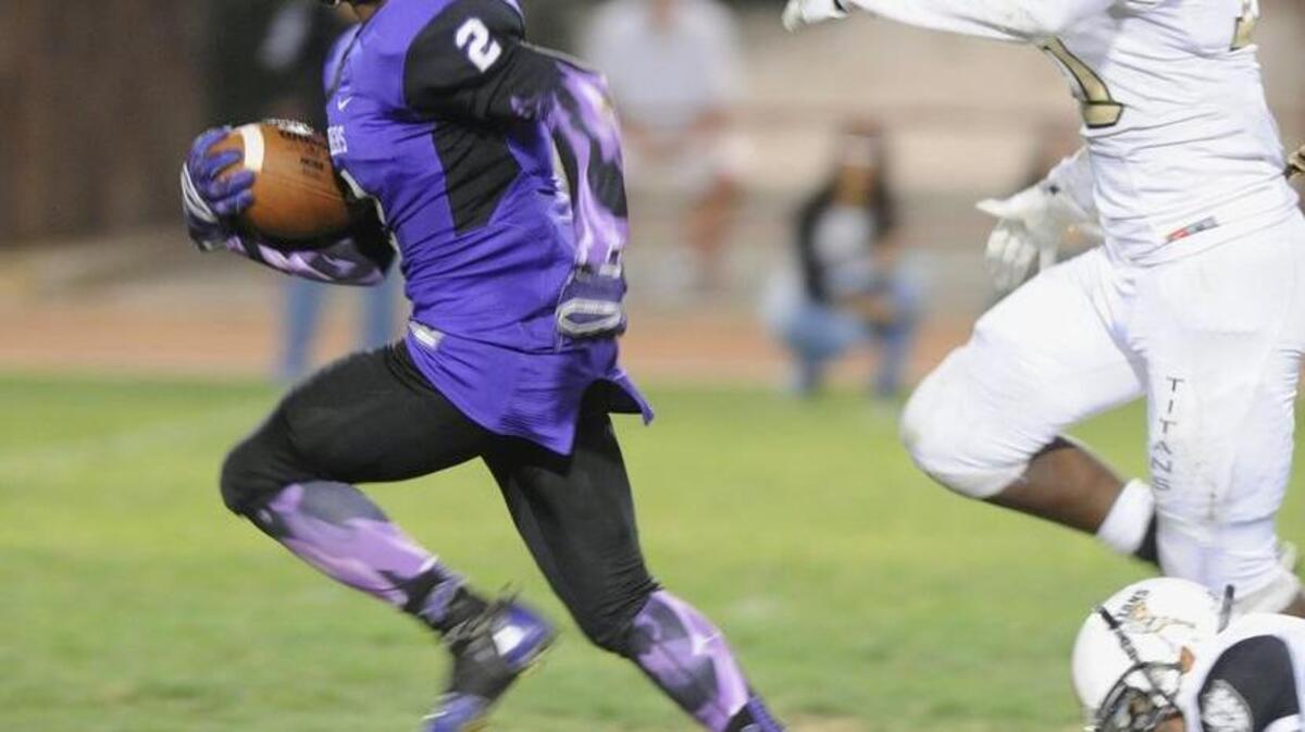 Pacheco’s Tk Teneng, left, did plenty of breaking into the open field this season, earning WAC co-Outstanding Offensive Player for his efforts.