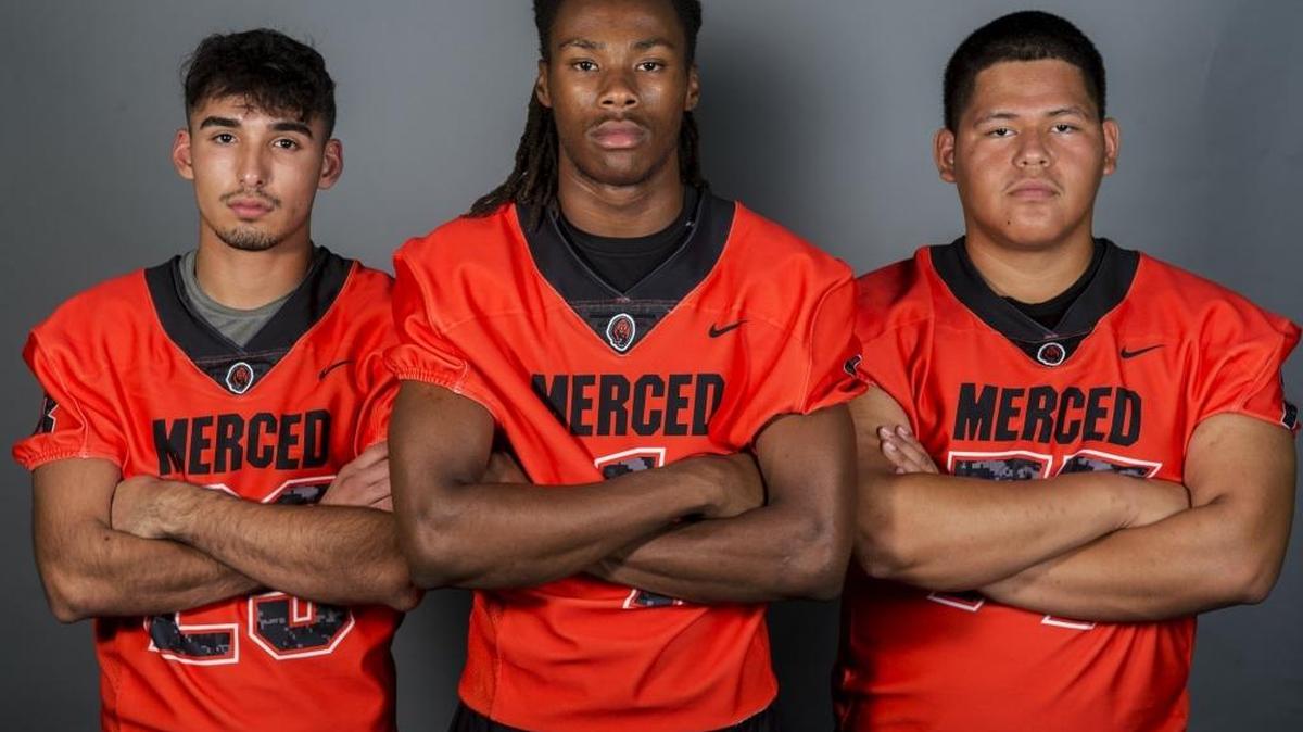 Merced High School football players Andre Barnett, left, Dhameer Warren, center, and Michael Rogel, right, pose for a portrait at the Merced Sun-Star office in Merced, Calif., on Wednesday, Aug. 2, 2017.