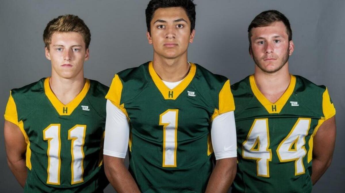 Hilmar High School football players Carter Azevedo, left, Tristan Crowley, center, and Tyler Amarante, right, pose for a portrait at the Merced Sun-Star office in Merced, Calif., on Wednesday, Aug. 2, 2017.