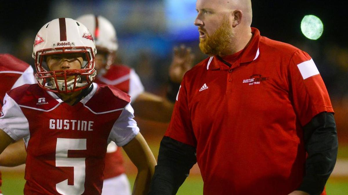 Gustine head coach Russell McWilliams talks to his team during a timeout during a game between the 9-0 Redskins and 9-0 Orestimba High. The Warriors won 21-13 to secure the Southern League title in Gustine, Calif., on Nov. 6, 2015.