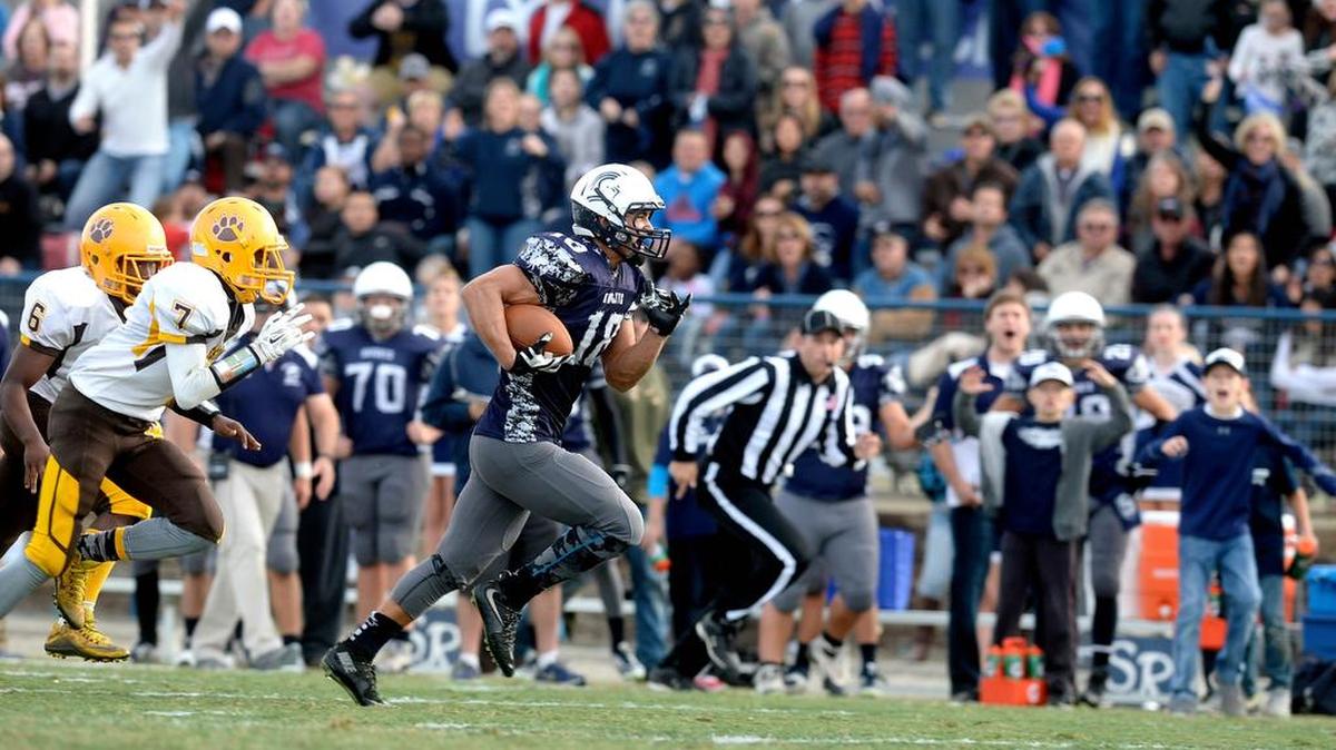 Stone Ridge Christian's Jonathan Collazo (18) takes off on one his breakaway touchdown runs, during the CIF State Play-In Game between the Mission High Bears of San Francisco and the Stone Ridge Christian High Knights on Saturday (12-5-15) at the Valley Sports Academy in Atwater.