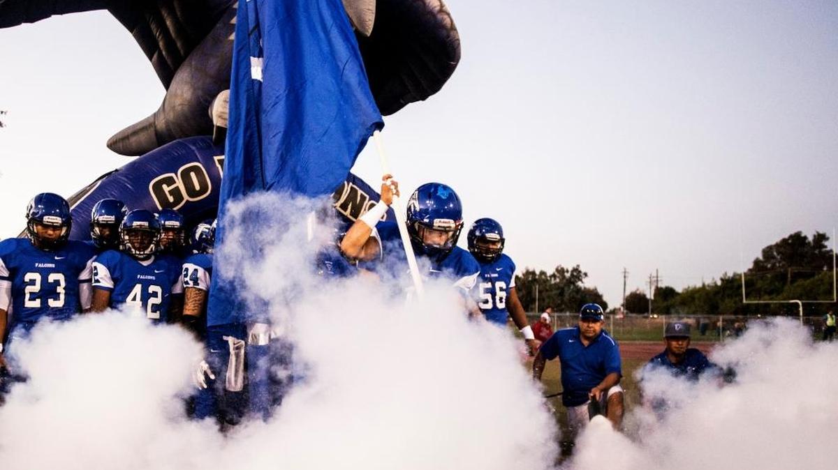 The Atwater Falcons take the field during a game against Patterson at Atwater High School in Atwater, Calif., Friday, Sept. 18, 2015. Former Falcons player Nelson Medeiros takes over as Atwater coach this season.