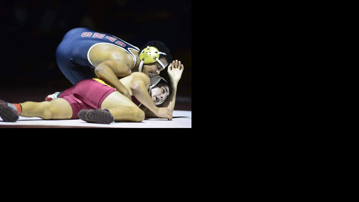 
Golden Valley High’s Joey Terry, top, gains control of Josh Bustamante of Los Banos while wrestling in the 145 pound weight class during a match at Golden Valley High School on Wednesday. Terry beat Bustamante by a score of 15-9.
