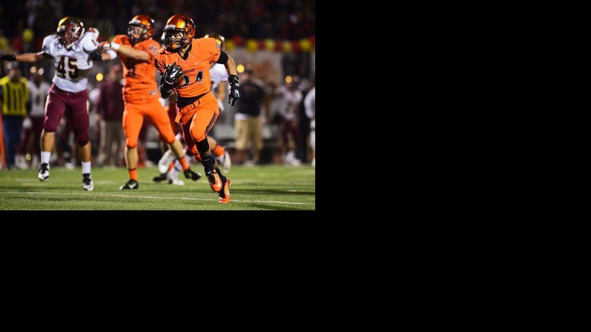 
Merced High sophomore running back Ulonzo Gilliam Jr. finds open field during a game against Golden Valley at Veterans Stadium on the campus of Golden Valley High School in Merced, Calif., Friday, Nov. 7, 2014.
