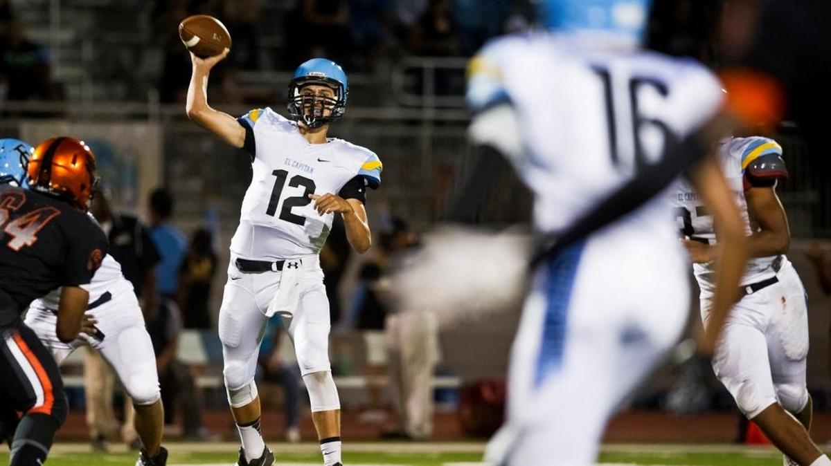 
El Capitan High School’s then-sophomore quarterback Chase Whitaker targets junior wide receiver Marcos Dinkins during a game against Merced at Veterans Stadium in Mercedin September 2014. The Bears beat the Gauchos 63-8.
