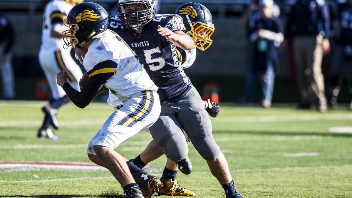 Mark Hooker sacks Big Valley Christian quarterback Noah Magana, one of his 32 on the season.