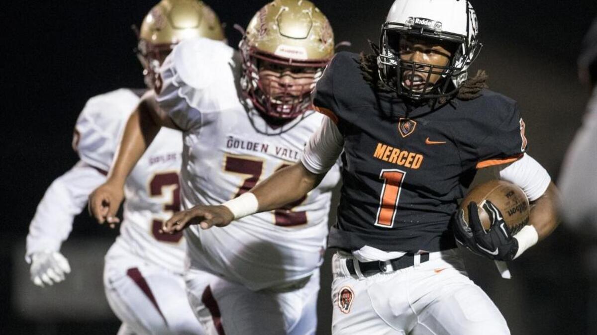 Merced sophomore quarterback Dhameer Warren (1) rushes during the Battle for the Mayor's Cup against Golden Valley at Veterans Stadium on the campus of Golden Valley High School in Merced, Calif., Friday, Nov. 4, 2016. The Bears beat the Cougars 44-14.