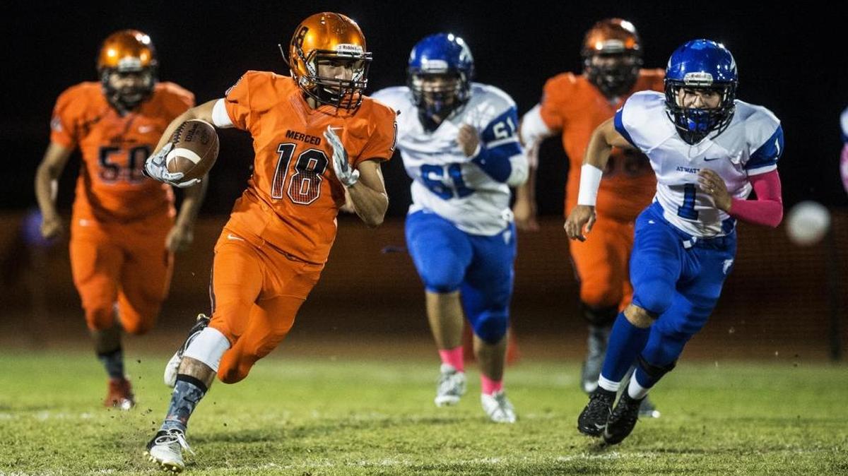 
Merced senior wide receiver Timothee Miranda (18) breaks free from the Atwater defense during a game at Merced High School in Merced, Calif., Friday, Oct. 9, 2015. The Bears beat the Falcons 39-14.
