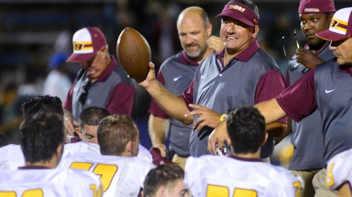 
Los Banos head coach Dustin Caropreso talks to his team after a game between Los Banos and Davis, where Los Banos won 48-0 at Modesto Junior College on September 11, 2015.
