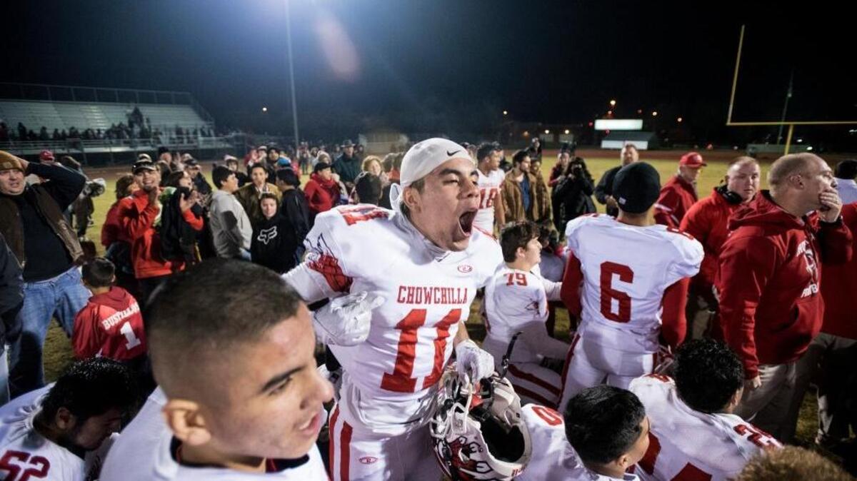 Chowchilla sophomore Eliseo Mendoza (11) jumps up and down while celebrating a 26-24 win over the Golden West Trailblazers during the Central Section CIF Division IV Semifinal game at Groppetti Community Stadium in Visalia, Calif., on Friday, Nov. 25, 2016. The Redskins scored a touchdown as time expired.