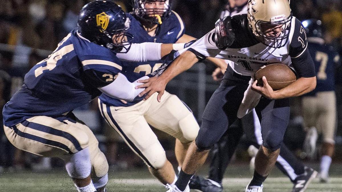 Turlock’s Mustafa Noel-Johnson sacks Buhach Colony quarterback Clay Abrams during the Central California Conference game in Turlock, Calif., on Friday, Sept. 23, 2016. Turlock won the game 49-27.