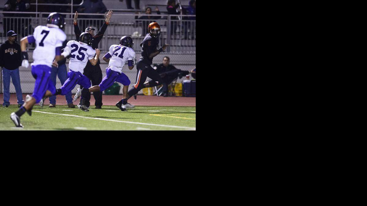 
Tyrone Williams, right, and Merced ran away from Tokay on Friday night at Golden Valley High in Merced. The Bears cruised to victory over the Tigers in their Sac-Joaquin Section Division I playoff opener, winning 66-27.


