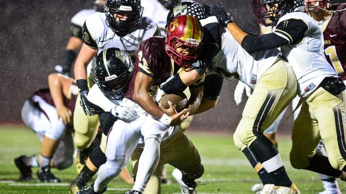
Golden Valley’s then-sophomore running back Isaiah Montanez (25) is brought down by a gang of Buhach Colony tacklers during a game last October at Golden Valley High School in Merced.
