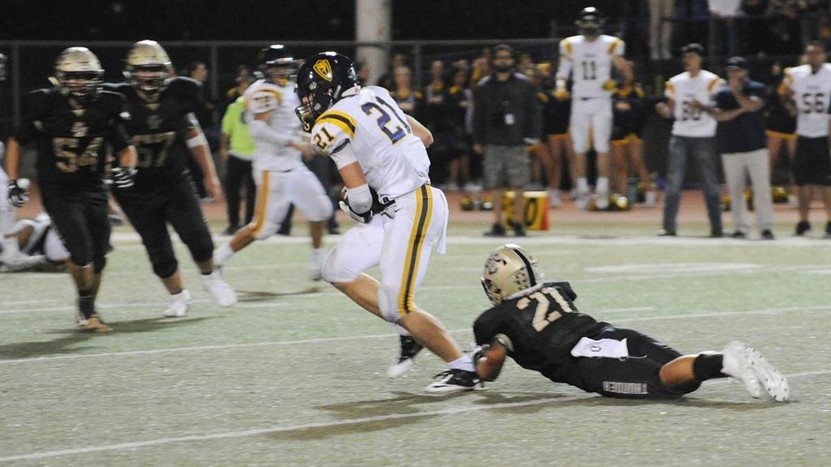 Turlock High strong safety Dustin Grein steps in front of Buhach Colony receiver Christian Quirarte late in the fourth quarter and intercepts the ball. Grein was named the Central California Conference MVP.
