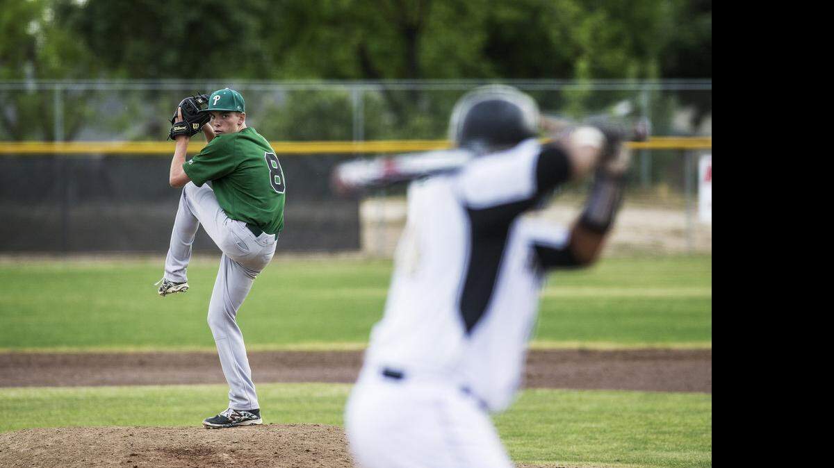 
Pitman sophomore Nick Jones (8) delivers a pitch during a game against Buhach Colony at Buhach Colony High School in Atwater, Calif., Tuesday, April 21, 2015.
